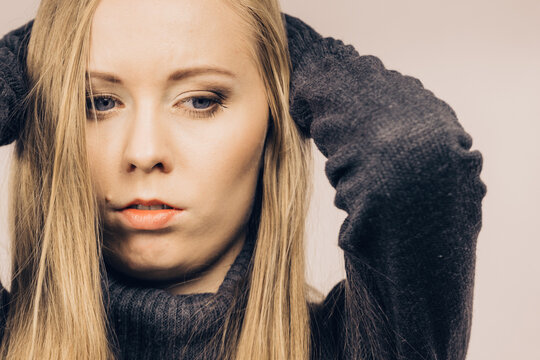 Sad confused young female