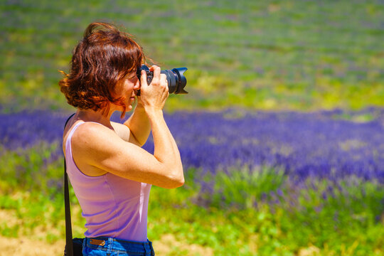 Tourist woman take photo on lavender field, Provence France