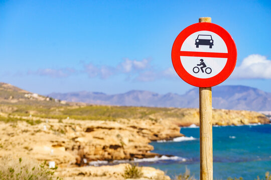 No cars and no motorcycles allowed sign at coastal area. No vehicle symbol. Region of Mazarron, Murcia Spain.