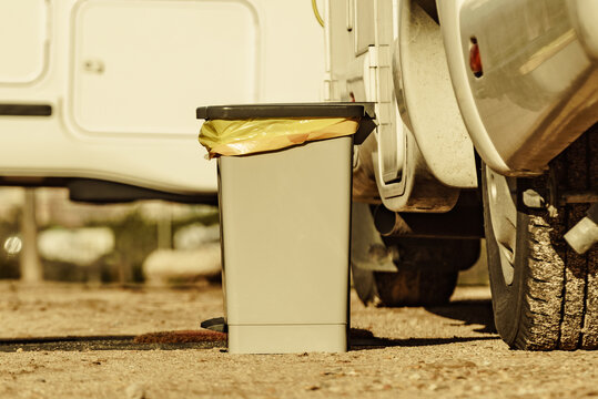 Trash can in front of caravan