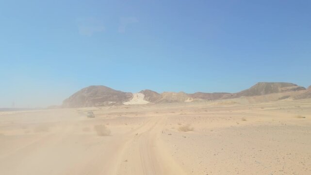 Rear view from off-road vehicle in the desert, Egypt