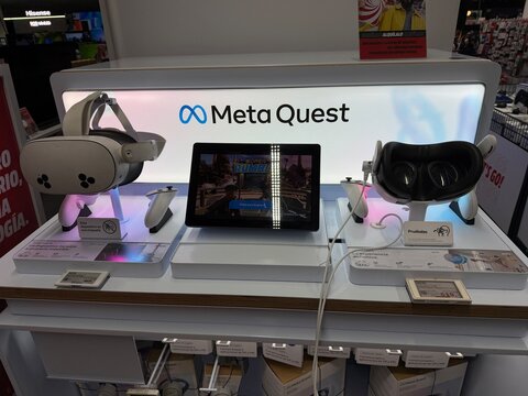 Mallorca, spain, july 09, 2026, meta quest virtual reality headsets and tablet engaging customers at vibrant retail electronics store display