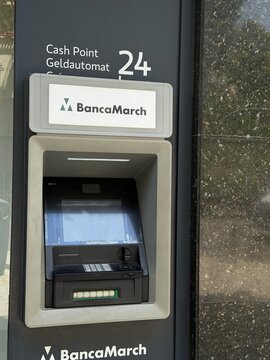 Mallorca, spain, july 09, 2026, banca march atm displaying availability and 24 hour cash point services for banking and financial transactions