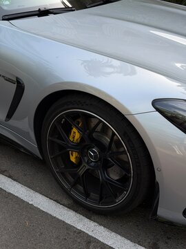 Mallorca, spain, july 09, 2026, mercedes amg gt 63 s e performance premium sports car wheel with matte black rim and yellow brake caliper