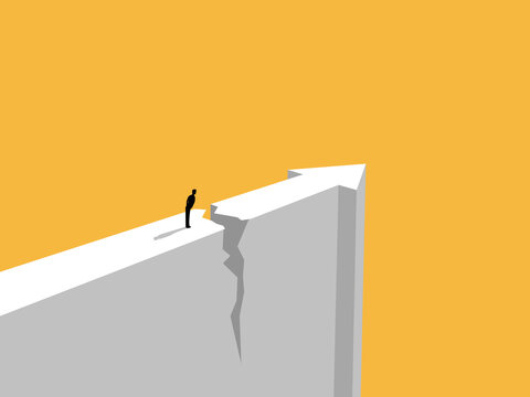 businessman faced an obstacle on a cracked cliff