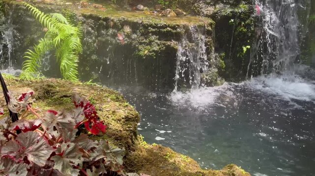 Waterfall over rocks in a garden