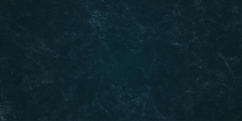 Dark charcoal grunge wall texture background. Dark black rough grunge surface with smoke edge. Black texture chalk board and black board. © MDFAIMIDULISLAM