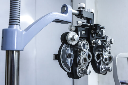 Close up modern digital phoropter and autorefractor equipment using for eyesight examination, precise vision testing, eye assessment, and prescribing corrective eyeglasses in modern optical clinic