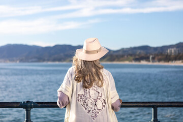Fototapeta premium Woman enjoying scenic ocean view