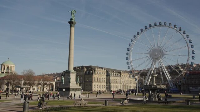 Stuttgart, Germany, 27 December 2025: Panoramic view of Schlossplatz in Stuttgart, Germany, featuring the Jubilee Column crowned by the goddess Concordia, the historic New Palace