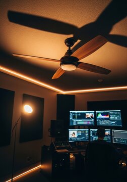 Room with ceiling fan and monitors
