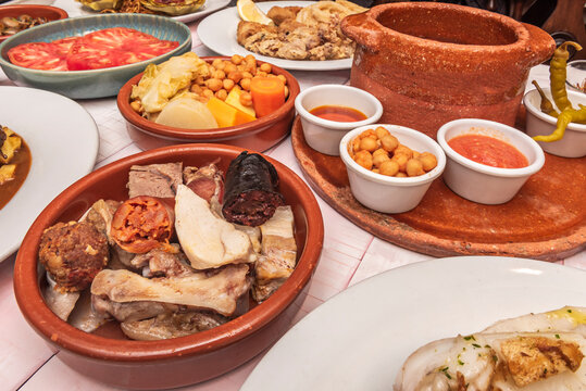 Close-Up of Traditional Madrid Cocido With Meats, Chickpeas and Vegetables in Clay Pots