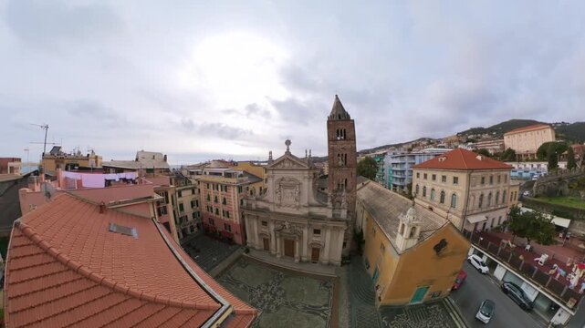 Panoramic 360 degree aerial view flying over the historic center of Varazze and its church