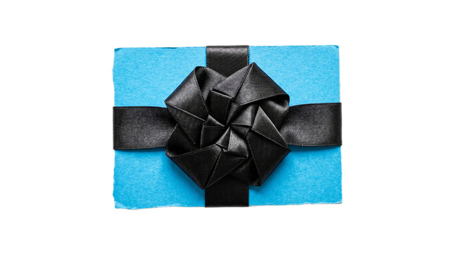 A beautifully wrapped gift box with a black ribbon on transparent background Typical brazilian food,