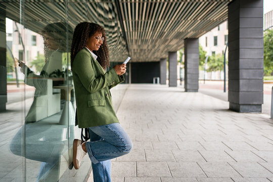Young Hispanic Latin American Business Woman Using Mobile Phone 