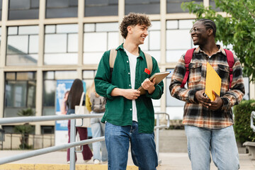 College Student friends Walking University staircase talking and laughing after lectures and exams