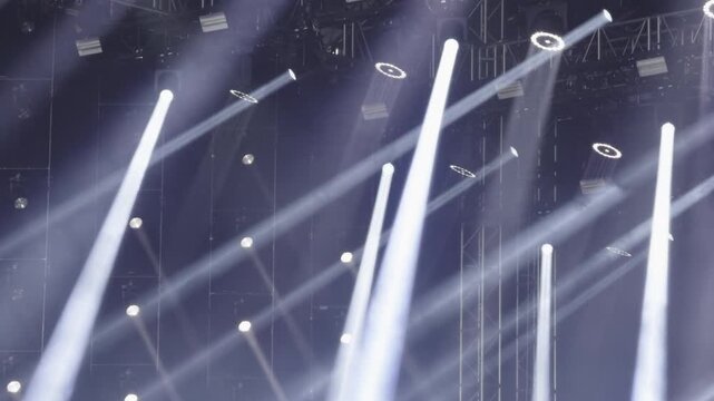 Concert stage lights creating dramatic illumination effect