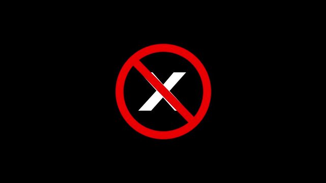 Prohibited sign with white cross on black background, danger alert symbol, no entry warning footage.
