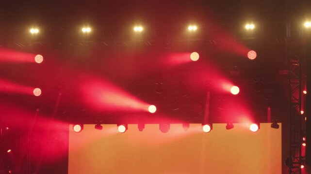 Professional stage lighting system with red spotlights at live event