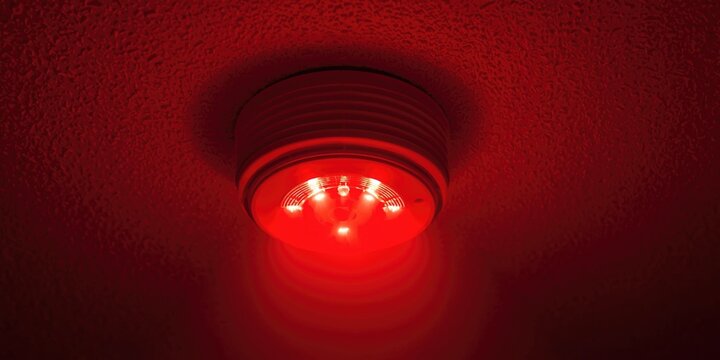 Red Emergency Light Mounted on Ceiling with Soft Glow