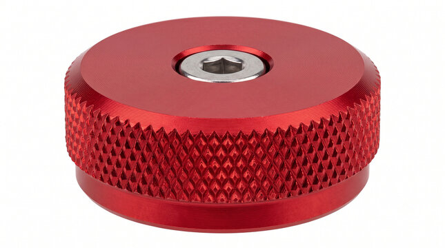Red anodized aluminum manual locking hub selector dial with knurled grips for 4WD vehicles, isolated on white.