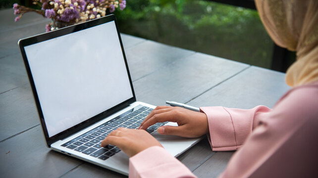 Muslim women working. Muslim woman wear hijab work from home office typing laptop keyboard on wooden desk office supply happy smiling face. Muslim woman wear hijab work from home office typing