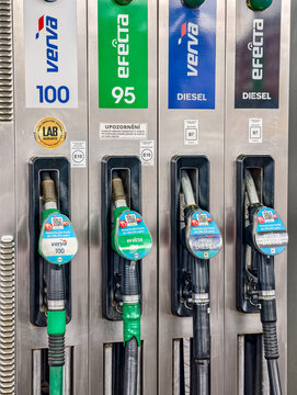 Prague, Czech Republic - July 23, 2026: ORLEN fuel dispenser with gasoline and diesel nozzles, digital display and convenience store at modern service station, transportation infrastructure