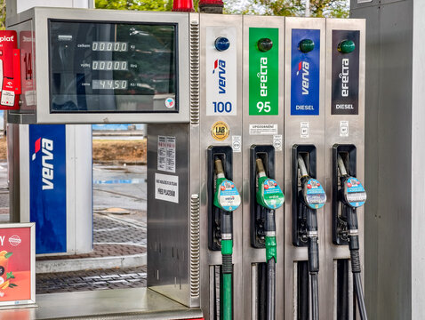Prague, Czech Republic - July 23, 2026: ORLEN fuel dispenser with gasoline and diesel nozzles, digital display and convenience store at modern service station, transportation infrastructure