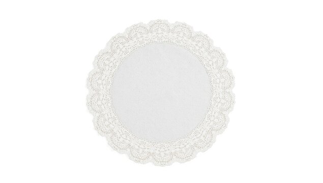 White lace doily with scalloped edges on a plain background