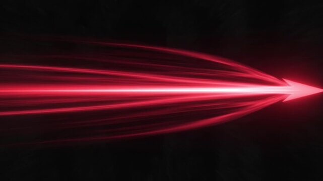 Glowing red light streak arrow pointing right representing speed energy success concept