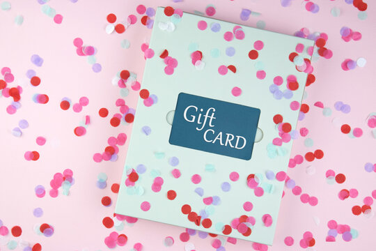 Blue Gift Card with flowers on a light background