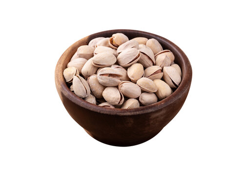 Salted roasted pistachios on a bowl isolated over white background