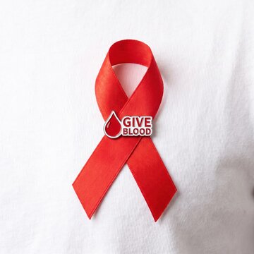 Red awareness ribbon with give emblem pinned on white fabric