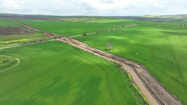 Aerial view of gas and oil pipeline construction. Pipes welded together. Big pipeline is under construction.