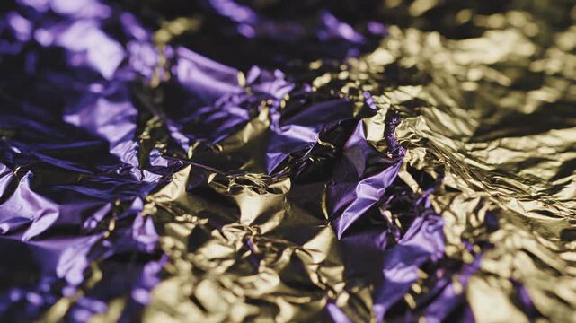 Bright colors shine on crumpled foil during creative project at a studio