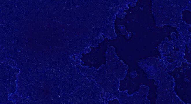 Abstract background of deep indigo blue dye spreading across a textured surface creating a messy, vibrant pattern ,diffusion ,background ,dye