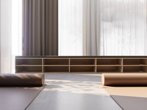 Minimalist empty yoga studio with mats and soft natural light