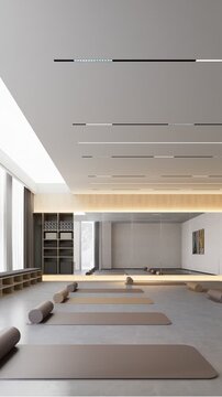 Empty modern yoga studio prepared with mats and rollers for restorative yoga