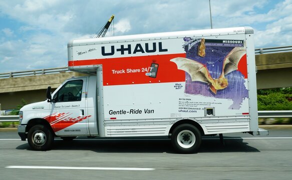 Pennsylvania, U.S.A - Jul 4, 2026 - U-Haul truck on highway displaying Missouri bat-themed artwork and informational text about bat communication and echolocation.