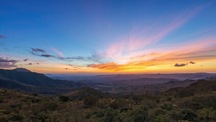 Obraz premium Vibrant Sunset Over Rolling Hills - Panoramic View, Serene Nature, Warm Colors