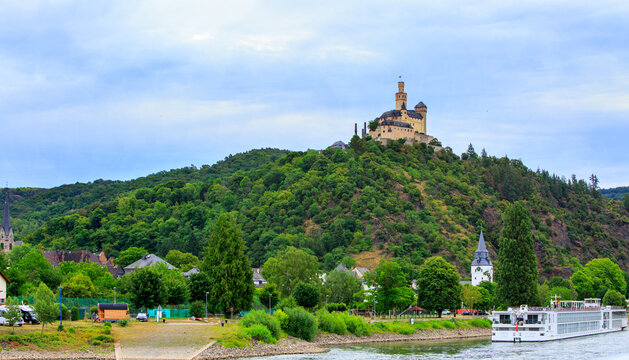 Marksburg Castle, a stunning medieval fortress perched on a hill above the Rhine River and the historic town of Braubach