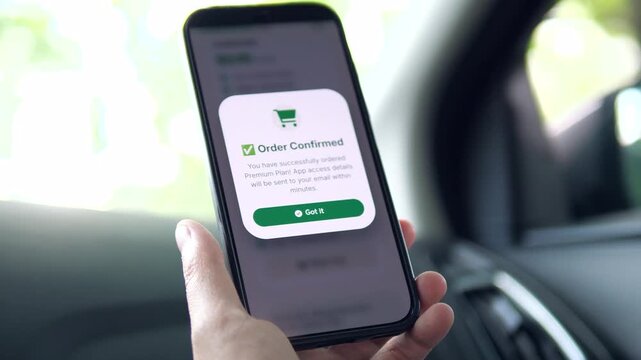 Smartphone screen displaying a clean order confirmation for a Premium Plan subscription. Interface shows successful purchase notification with email delivery details and a Got it button. Represents