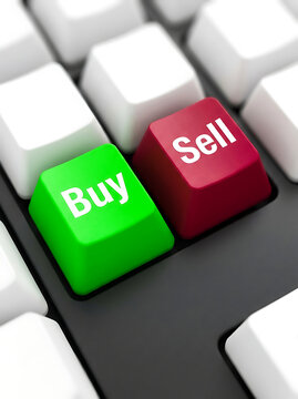 Green buy and red sell keys on a keyboard with selective focus during business concept