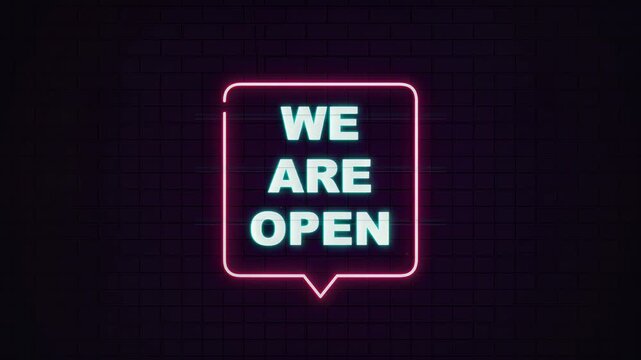 Vibrant neon sign with 'WE ARE OPEN' text in a speech bubble, glowing pink and green, symbolizing business availability and welcoming atmosphere