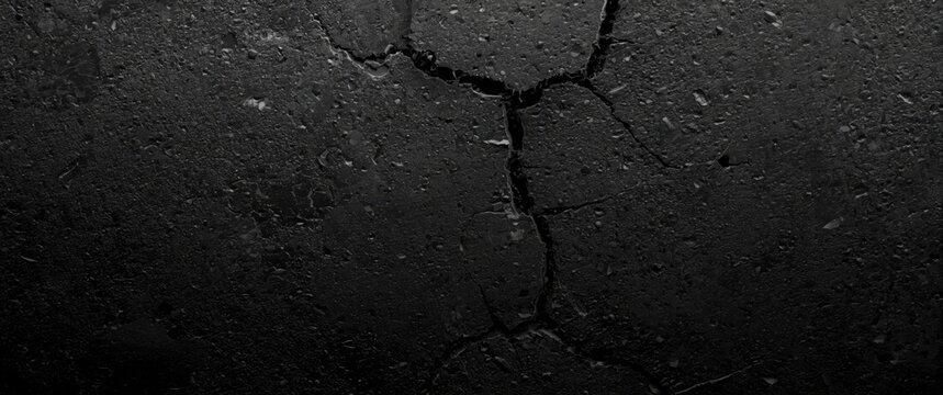 Cracked Dark Concrete Surface with Dim Lighting