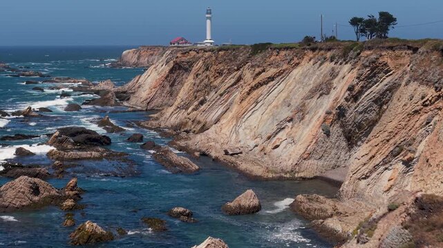 Explore the coast near Mendocino with aerial views of Point Arena Lighthouse and rugged cliffs along the Pacific Ocean.