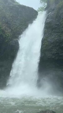 Ahupe Valley waterfall in stunning vertical 4K during the monsoon season.