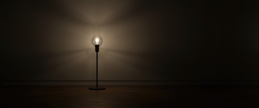 Standing Light Bulb Lamp Casting Shadows on a Dark Wall