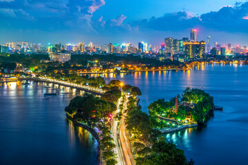 Fototapeta premium Panoramic night cityscape of Hanoi with Thanh Nien street light trails and West Lake