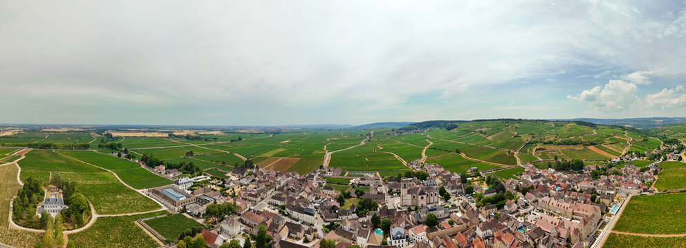 Panoramic aerial view of Pommard, Burgundy, France, showcasing Pinot Noir vineyards, viticulture, wine production, agriculture, and the surrounding village landscape.